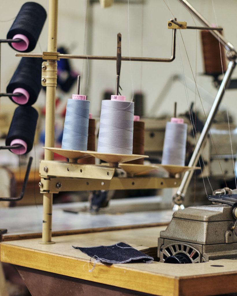 Close-up image of a lot of coils with a threads at the sewing workshop.